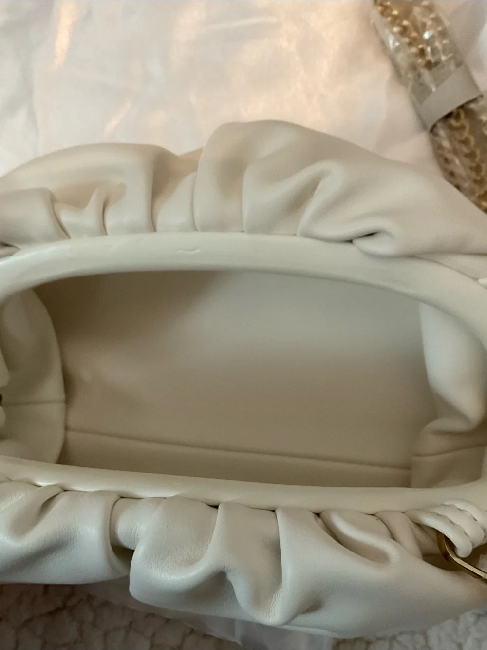 Understated Leather crescent cream